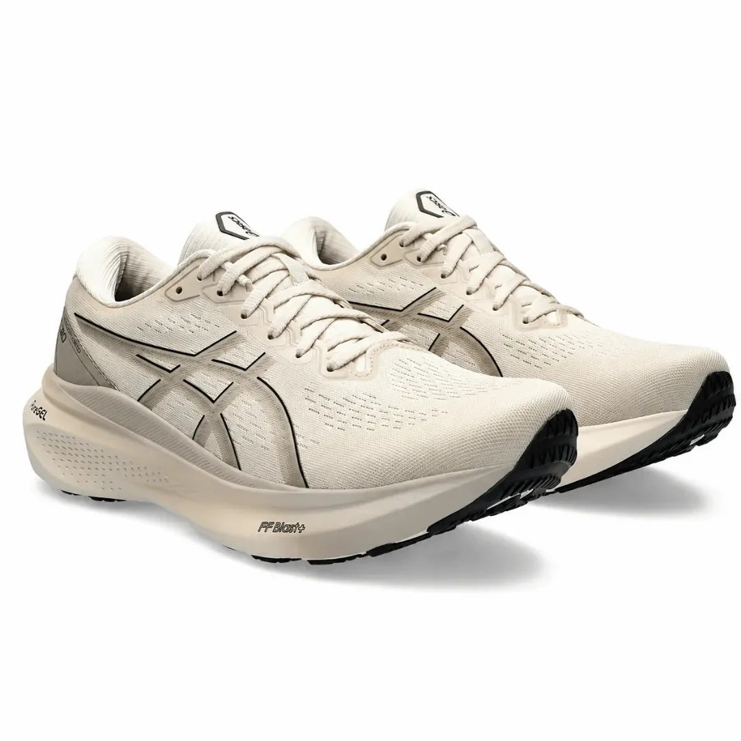 A pair of Asics running shoes in off-white and beige with dark gray and black accents, displayed on a clean white background.