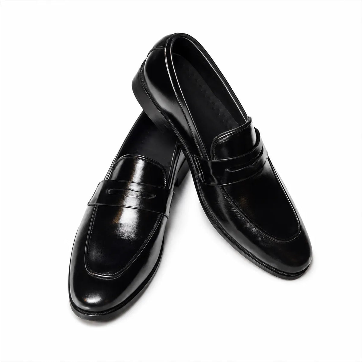 Elegant black leather penny loafers for men, perfect for office, weddings, and smart casual outfits.