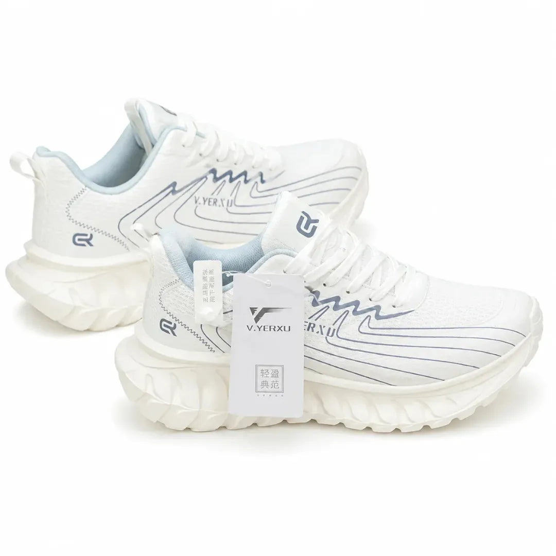 A pair of white athletic sneakers with light blue accents and dark gray graphic lines, shown on a clean white background. One shoe is positioned behind the other, with a white hangtag attached to the front shoe.