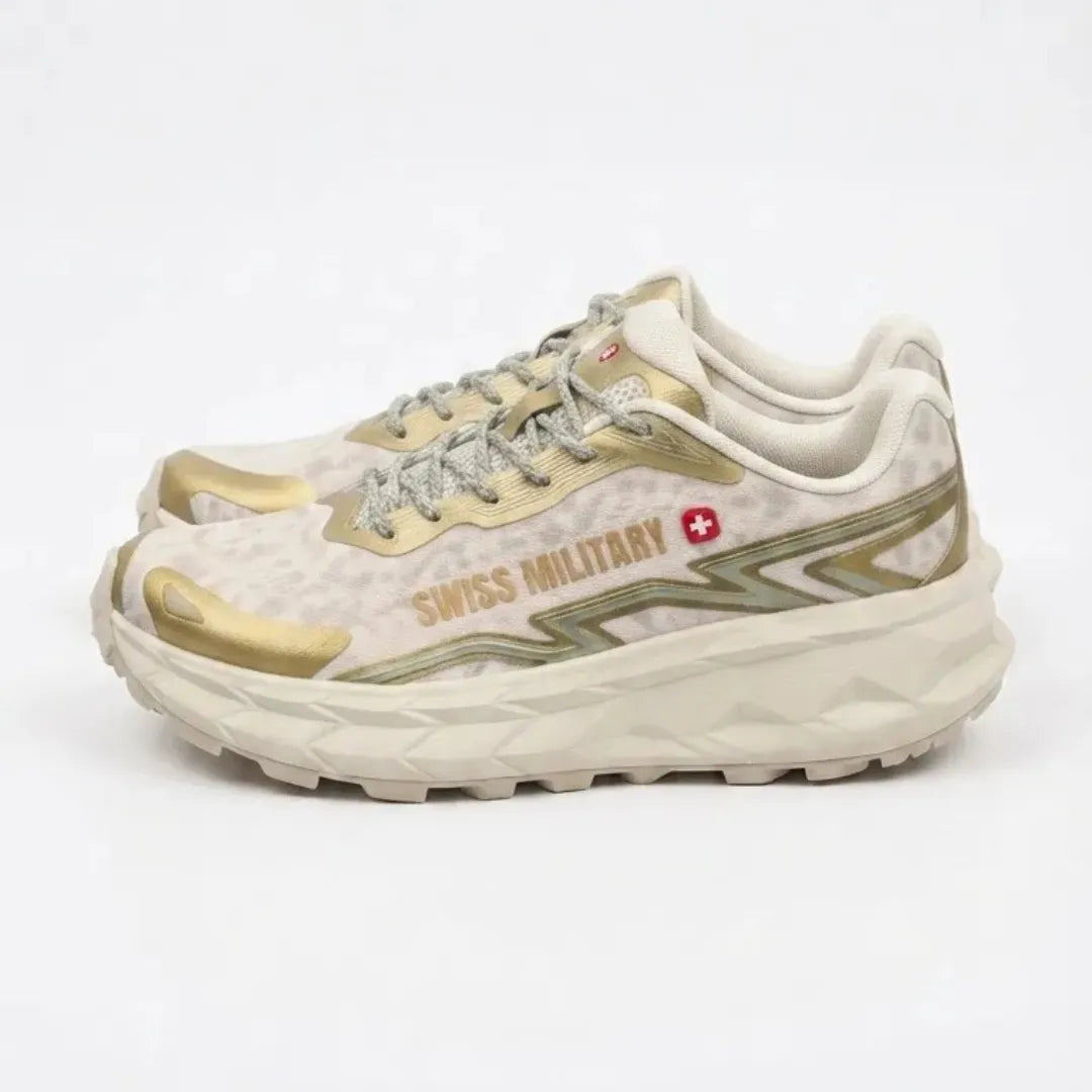 A white and navy blue On running shoe with a chunky, cushioned sole featuring circular cutouts, shown on a clean white background.