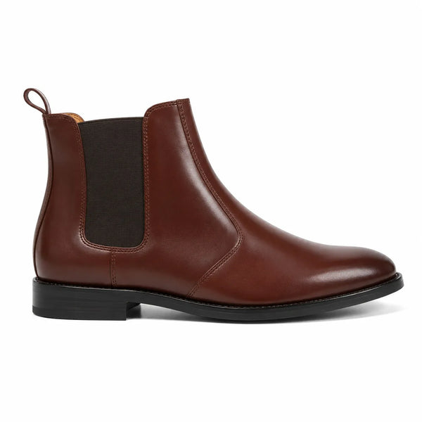 A brown leather Chelsea boot with a black elastic side panel and a black sole,