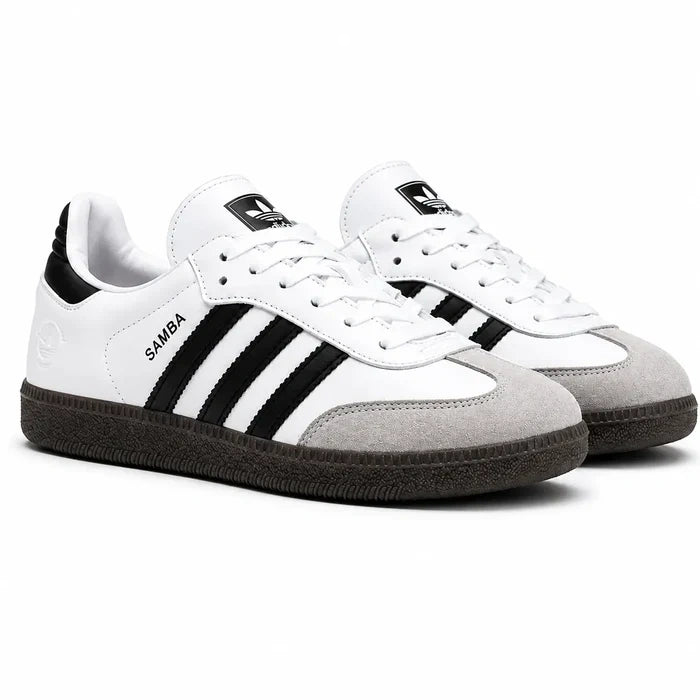 White Adidas Samba sneakers with black three stripe detailing
