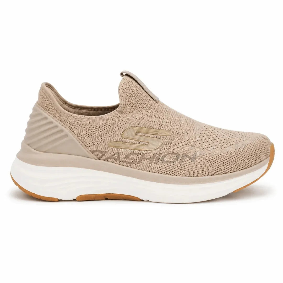 A beige slip-on sneaker with a textured knit upper, a gold 'SKECHERS' logo on the side, and a thick white midsole, shown against a plain white background.