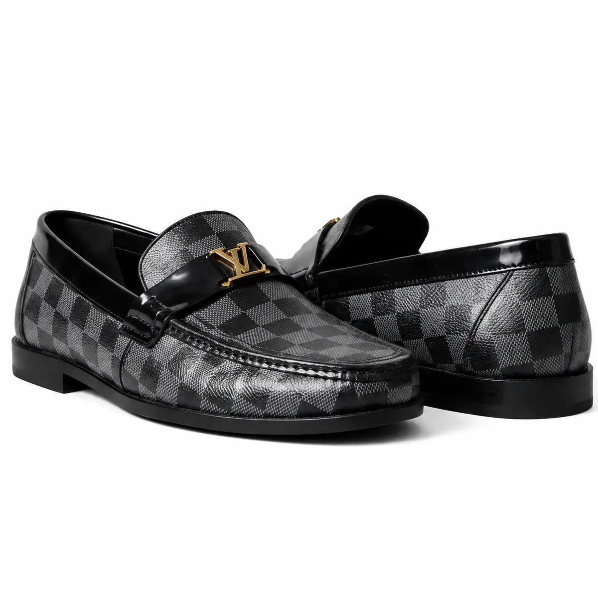 Black checkered leather loafers with gold buckle on white background