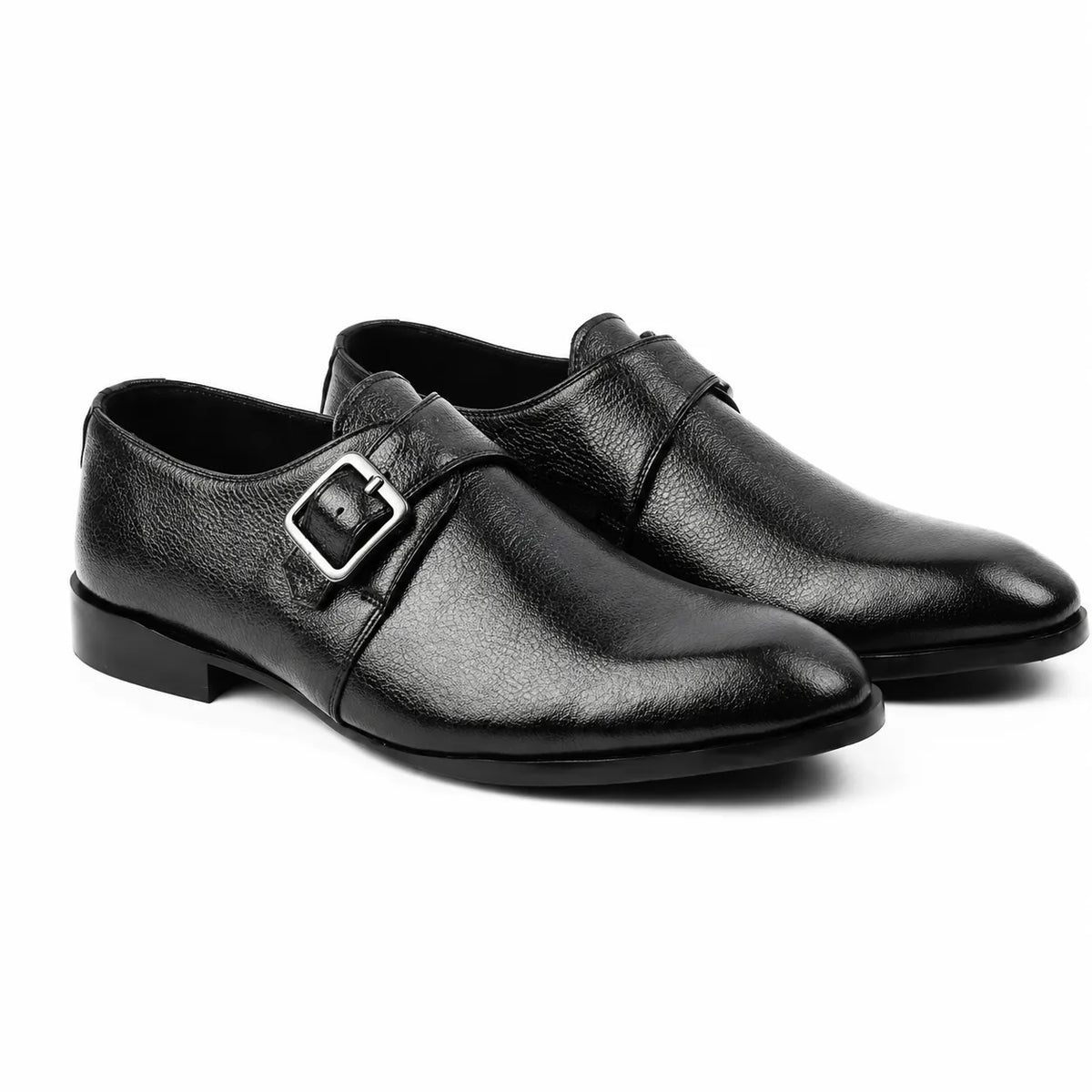 Black genuine leather monk strap formal shoes for men with silver buckle on a white background.