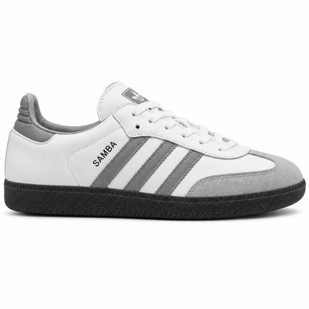 A white and gray Adidas Samba sneaker with a black sole, shown from a side profile view on a white background.