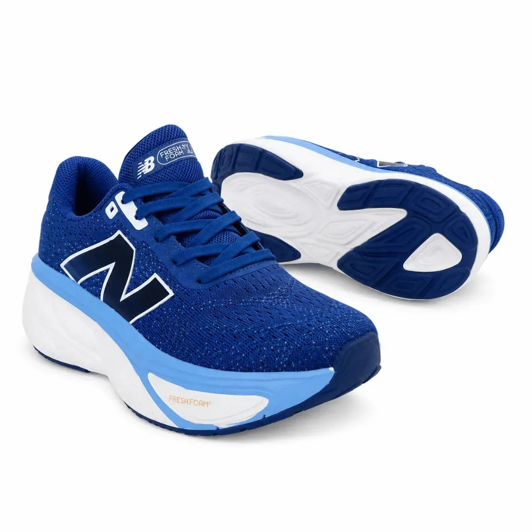 A pair of New Balance 1040 running shoes in royal blue, navy, and white, with one shoe showing the side profile and the other showing the sole.