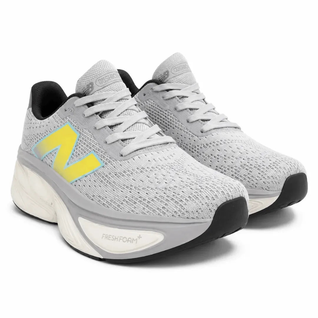 A pair of New Balance 1040 running shoes in light gray and white with a bright yellow 'N' logo on the side, shown against a plain white background.