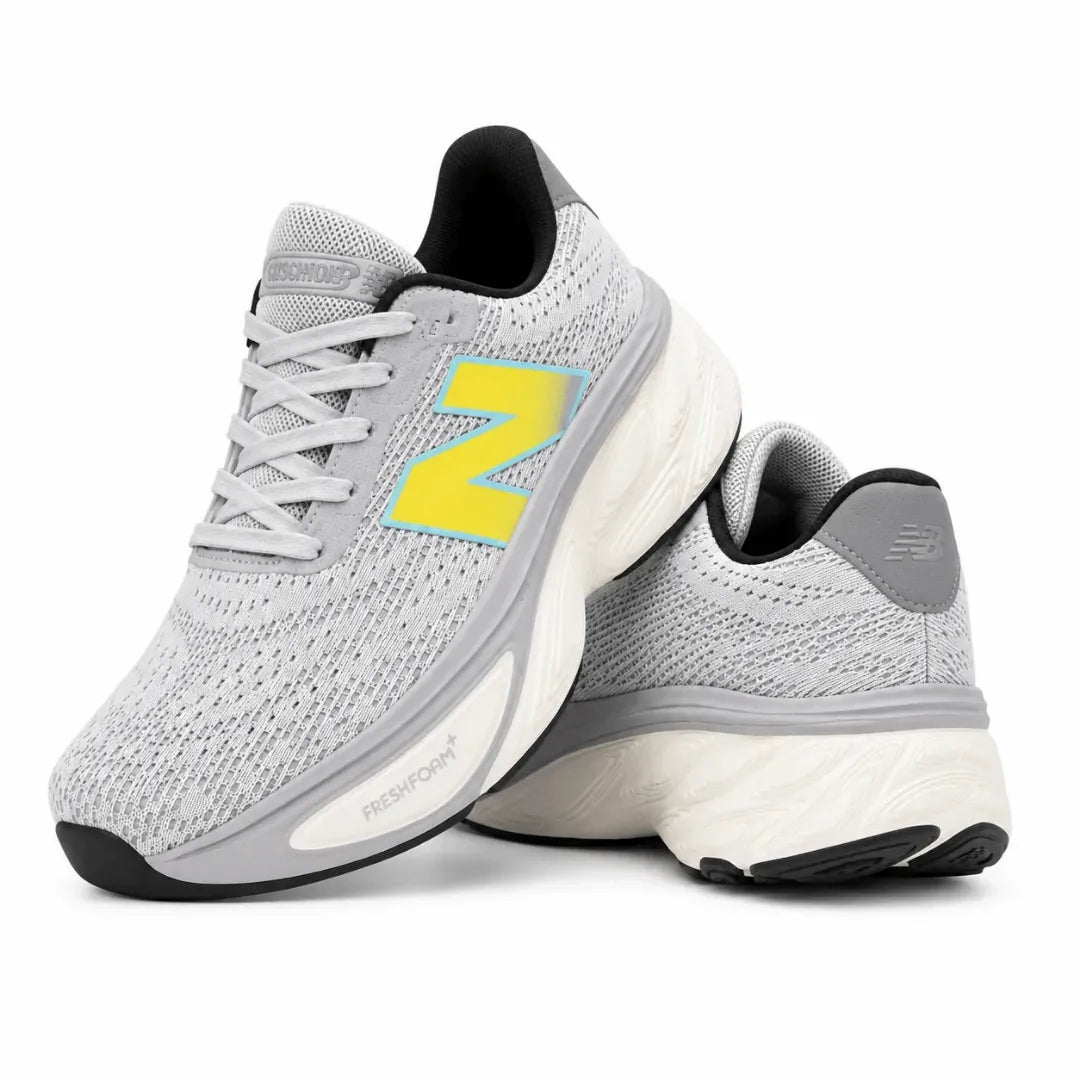 A pair of New Balance 9060 running shoes in light gray and white with a prominent yellow 'N' logo on the side, shown against a plain white background.