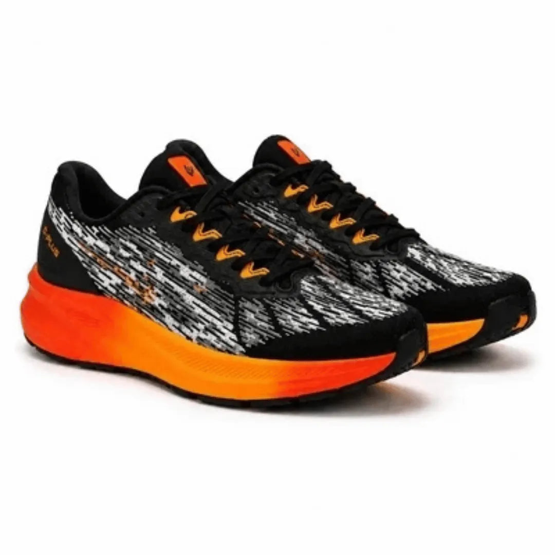 A pair of running shoes with a black and white textured knit upper, black laces, and a vibrant orange and yellow gradient midsole, shown on a white background.