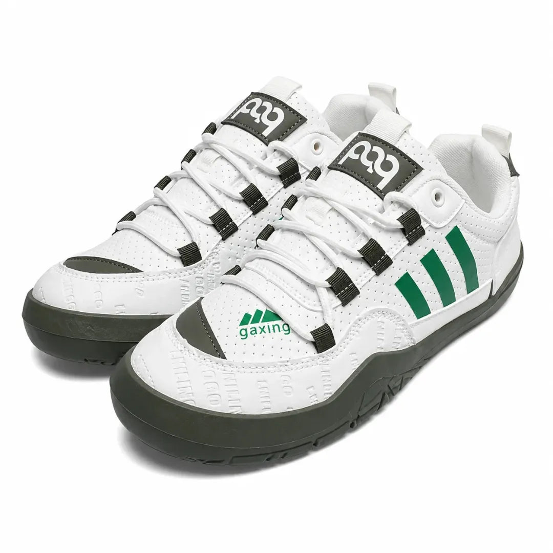 A pair of white low-top athletic sneakers with green accents, featuring three green stripes on the side, a green logo on the toe box, and black laces with black plastic eyelets.