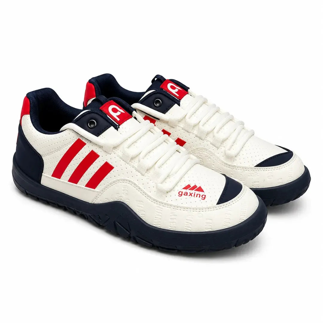 A pair of Gaxing brand low-top sneakers in white, navy blue, and red. The white leather upper features three red stripes on the side, a red logo on the tongue, and a red logo on the side panel.