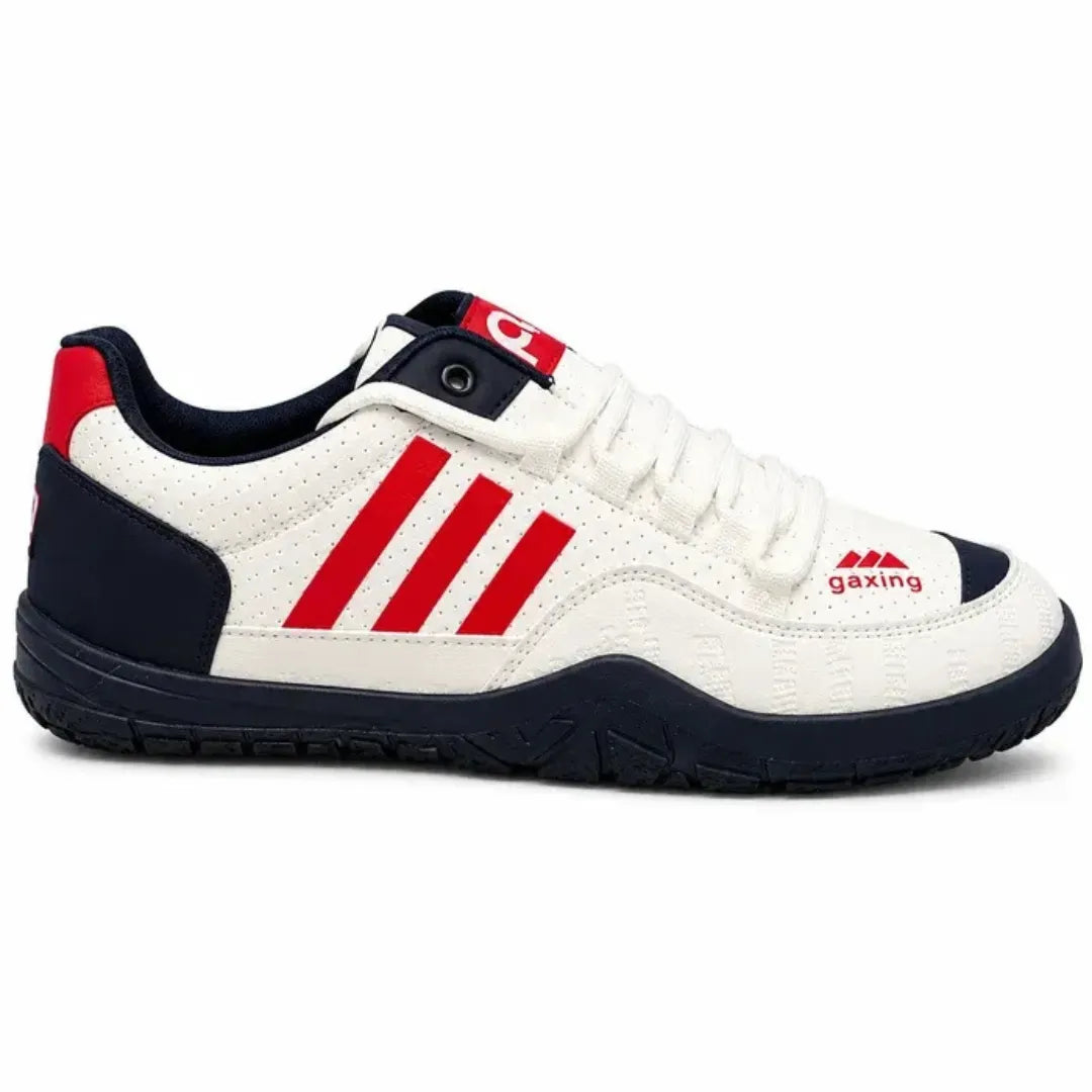 A low-top sneaker in white leather with three bold red stripes on the side, a red heel tab, a navy blue outsole, and a red 'gazing' logo on the side.