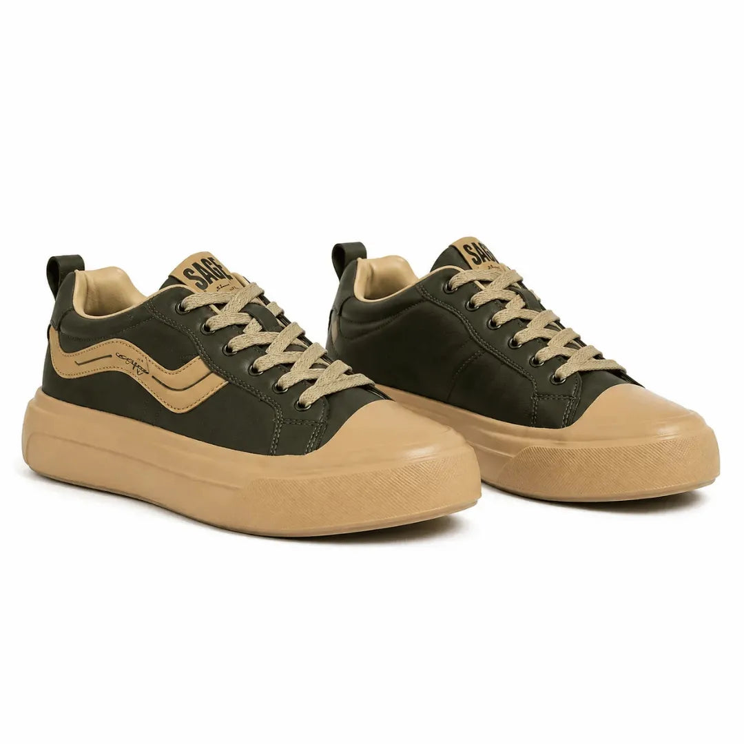 A pair of low-top sneakers in dark olive green and tan, featuring matching tan laces, a tan side stripe, and thick tan platform soles, shown on a white background.