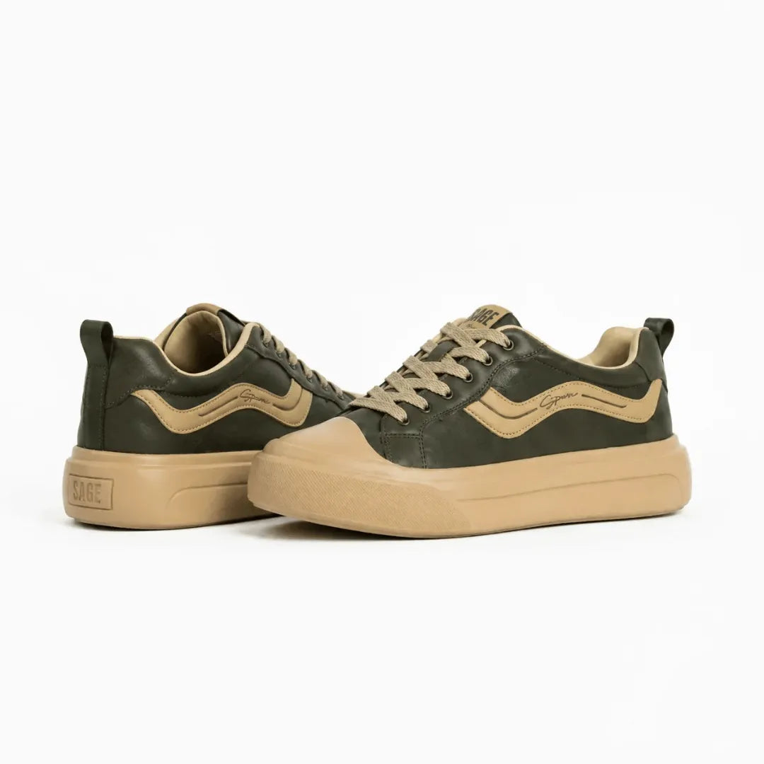 A pair of low-top sneakers in dark olive green with tan accents, including the side stripe, laces, and thick rubber sole, photographed on a clean white background.