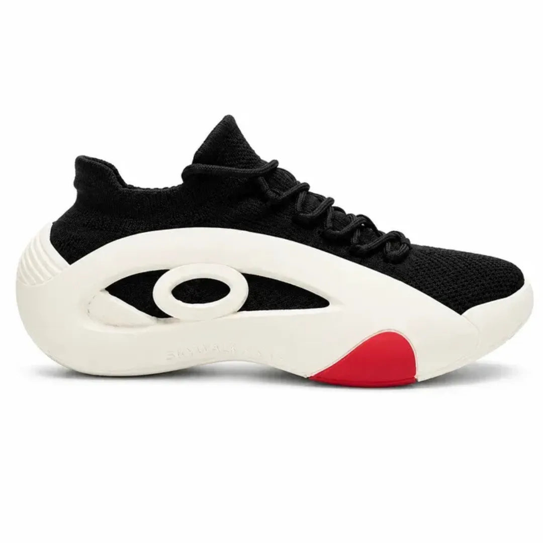 A black knit athletic sneaker with a thick white sculpted sole featuring a red accent on the heel, shown from the side against a white background.