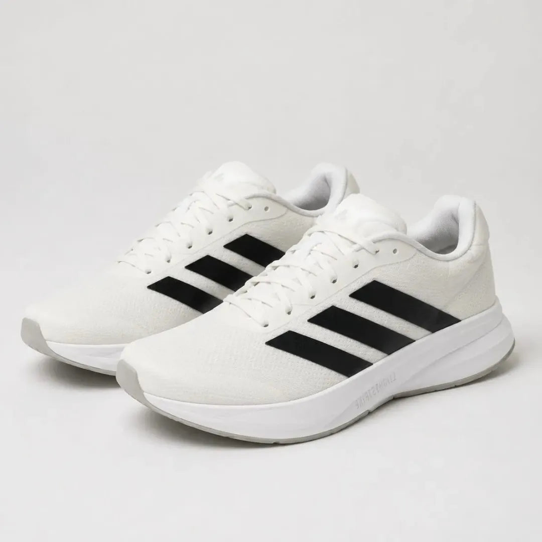 A pair of white Adidas running shoes with the signature three black stripes on the side, shown against a light gray studio background.