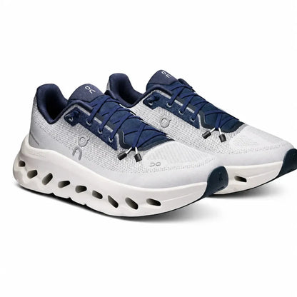 A pair of On Cloudrunner running shoes in white and navy blue, shown from a three-quarters angle on a clean white background.