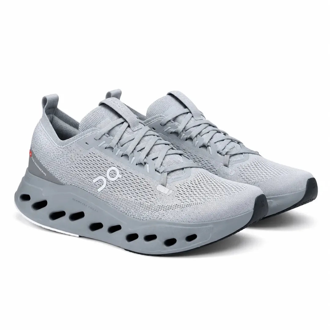 A pair of light gray running shoes with a breathable mesh upper, thick cushioned sole with cutout details, and the On logo on the side, shown against a plain white background.
