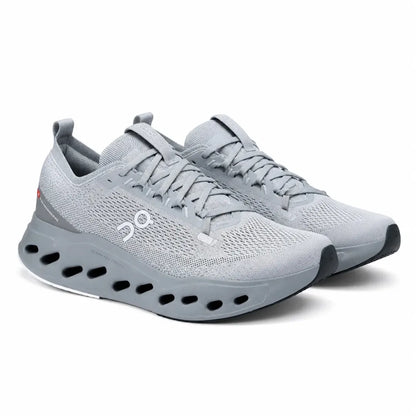 A pair of light gray running shoes with a breathable mesh upper, thick cushioned sole with cutout details, and the On logo on the side, shown against a plain white background.