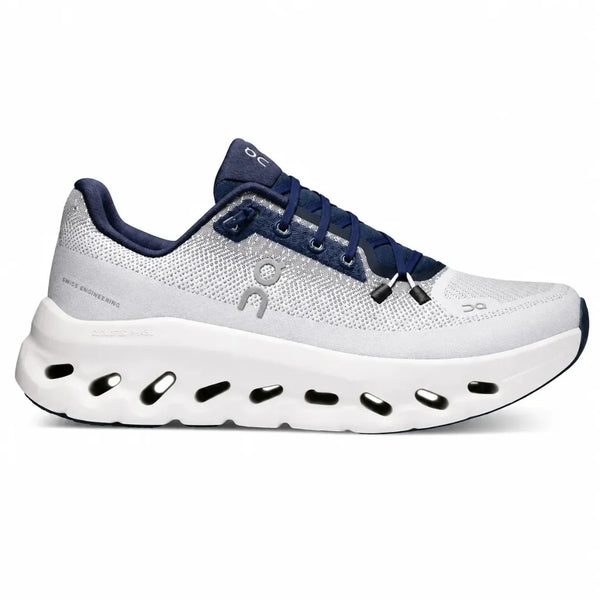 A light gray and navy blue running shoe from the brand On, shown in a side profile view against a plain white background.