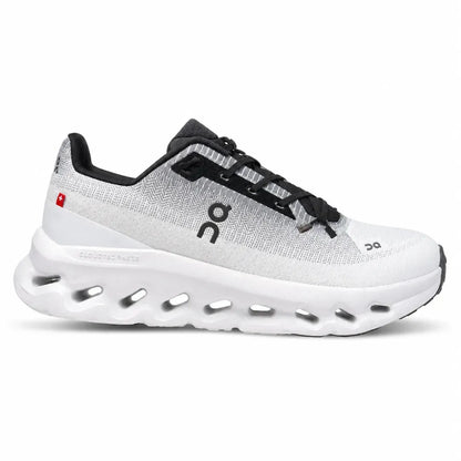 A pair of dark brown knit slip-on sneakers with white cushioned soles and a gum outsole, shown on a plain white background.