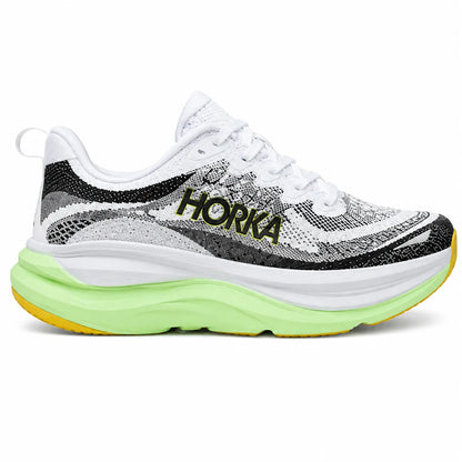 Pair of white and black HORKA athletic running shoes featuring a light green cushioned sole and yellow outsole accents on a clean white studio background.