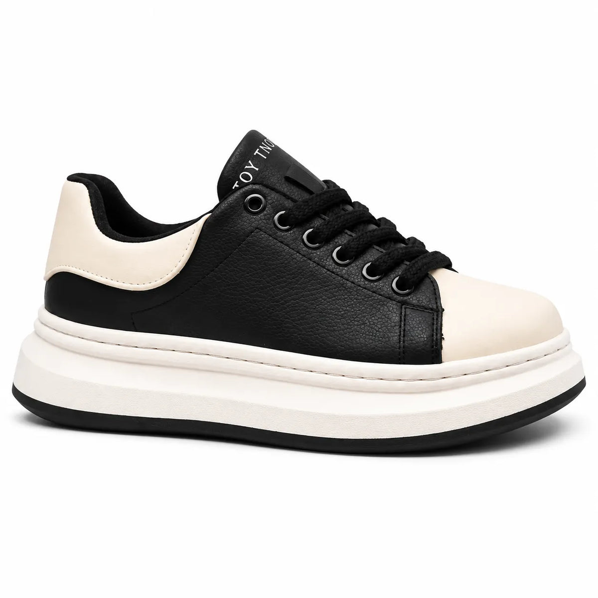 A low-top platform sneaker in black and off-white. The upper features a black pebbled leather body with a contrasting off-white toe cap and heel counter, black laces, and a thick off-white platform sole with a black outsole.