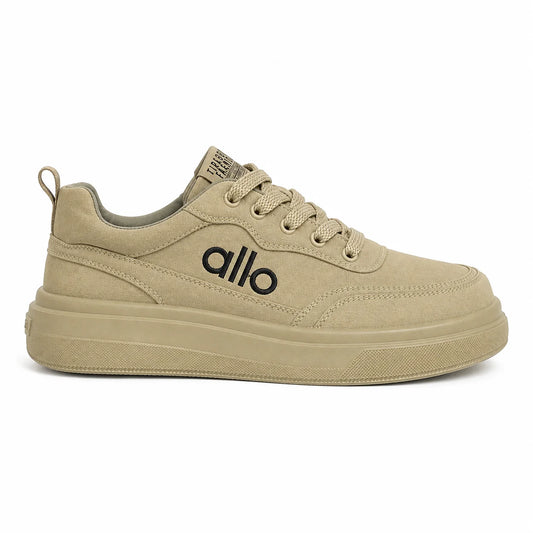 A beige low-top platform sneaker with a thick sole, matching beige laces, and a black 'allo' logo on the side, shown against a plain white background.