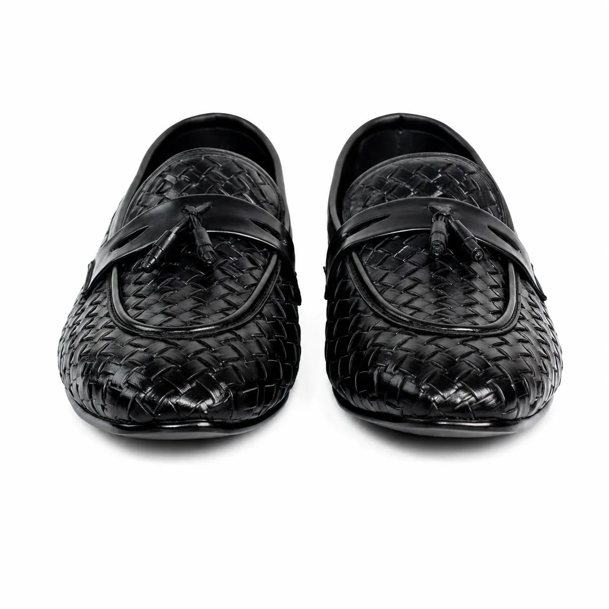 Men's black braided leather loafers with tassel detail on clean white background