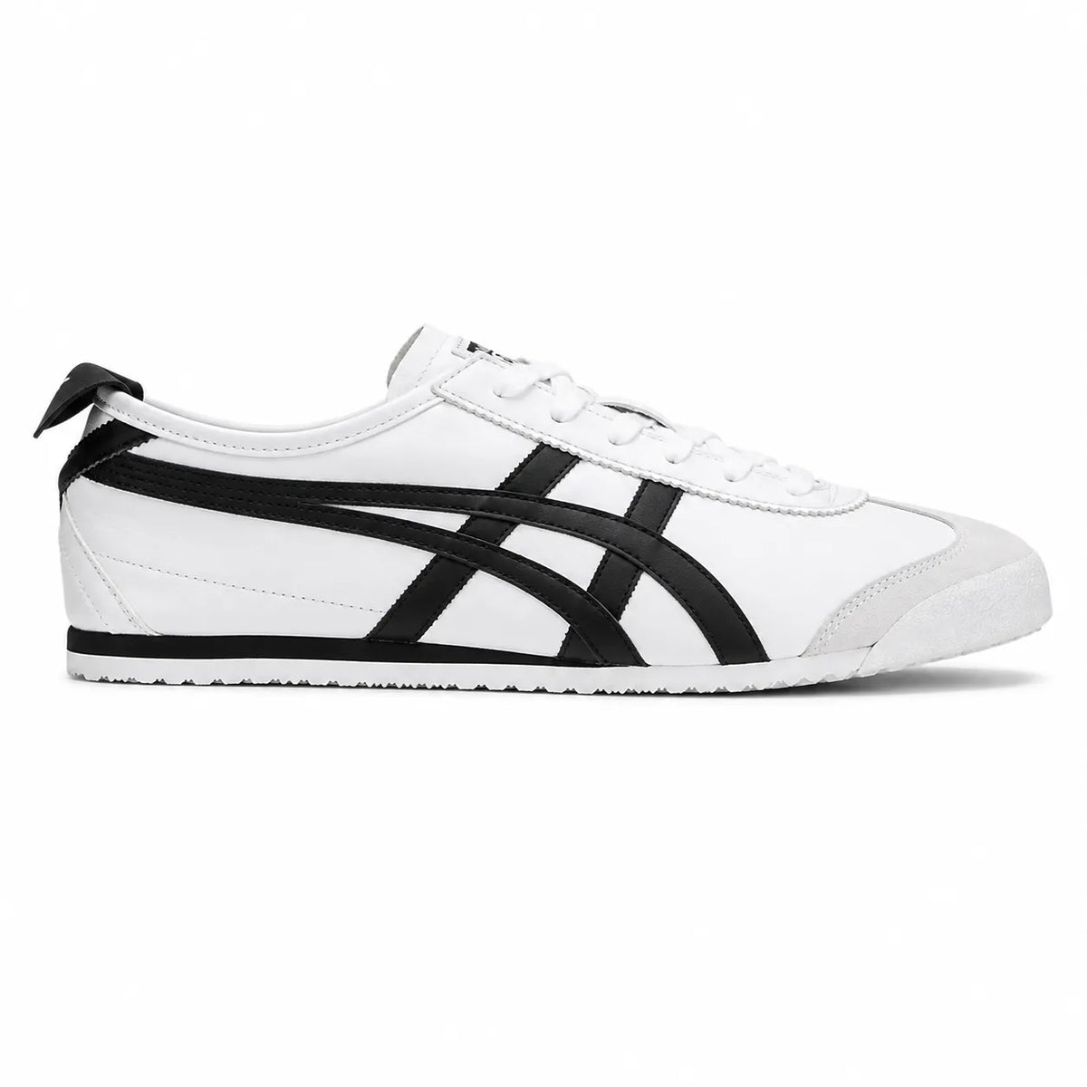 A classic low-top sneaker in white leather with black tiger stripes, white laces, and a white rubber toe cap, shown from a side profile view on a white background.