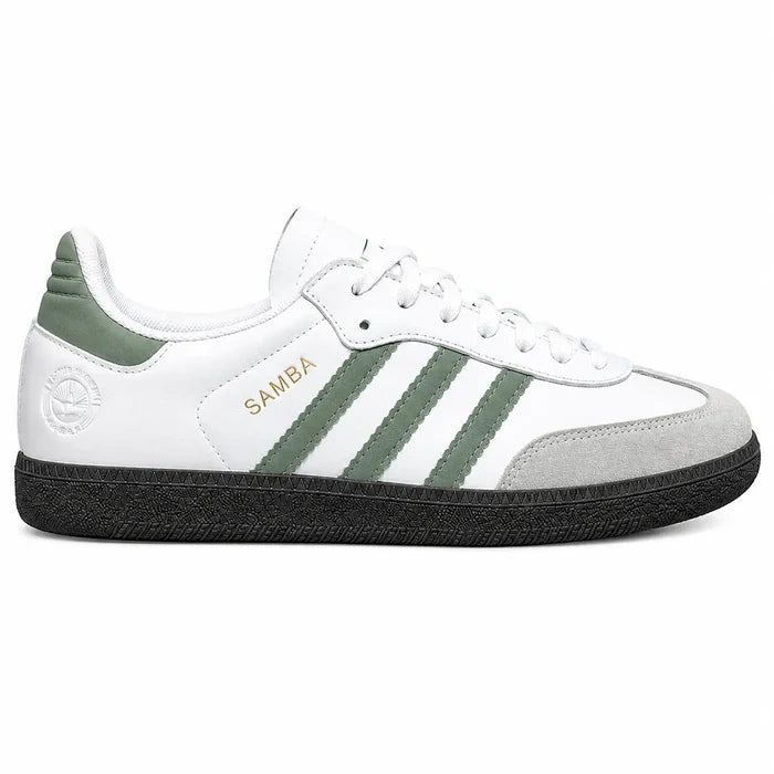 White Adidas Samba sneakers with green three stripe detailing