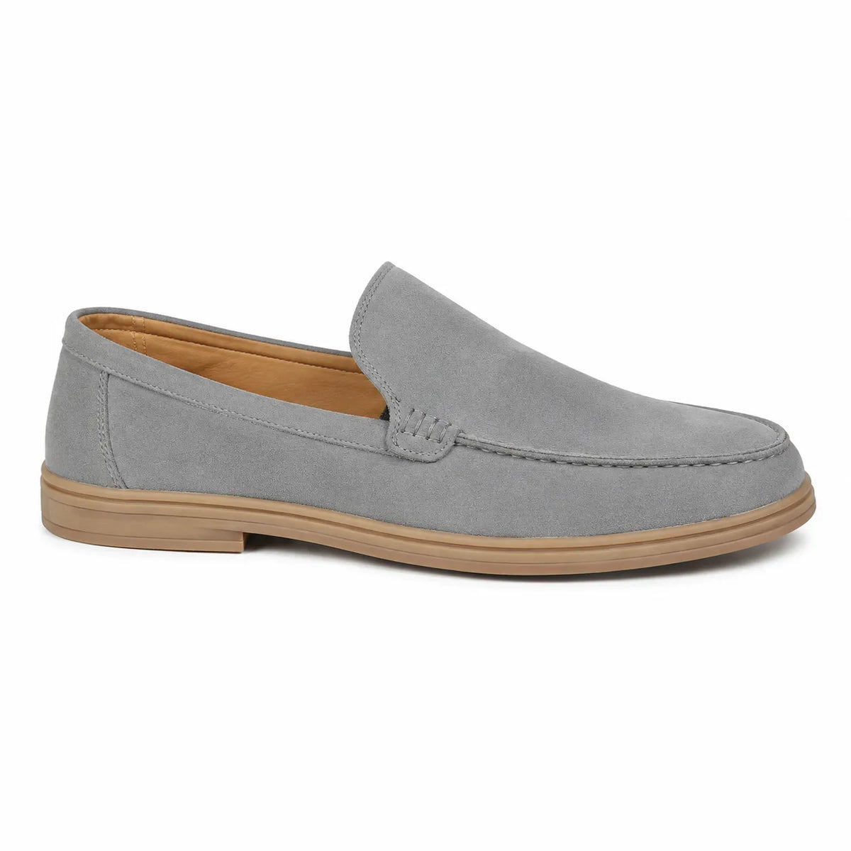 A light gray suede slip-on loafer with a tan sole 