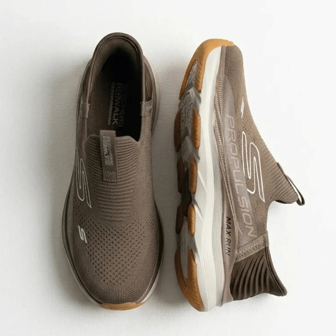 A pair of Skechers Propelion slip-on running shoes in taupe brown, showing both the top and side profile views against a plain white background.