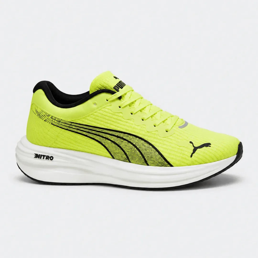 A Puma running shoe in neon yellow with black accents, featuring the Puma Formstrip and leaping cat logo, set against a light gray background.