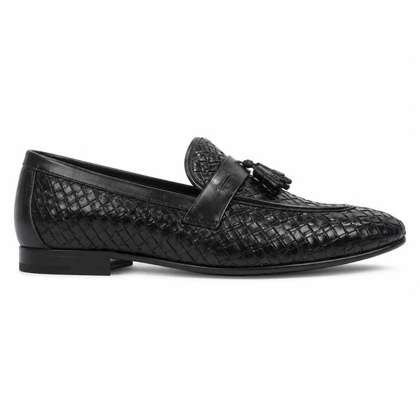 A single black woven leather loafer with a tassel strap