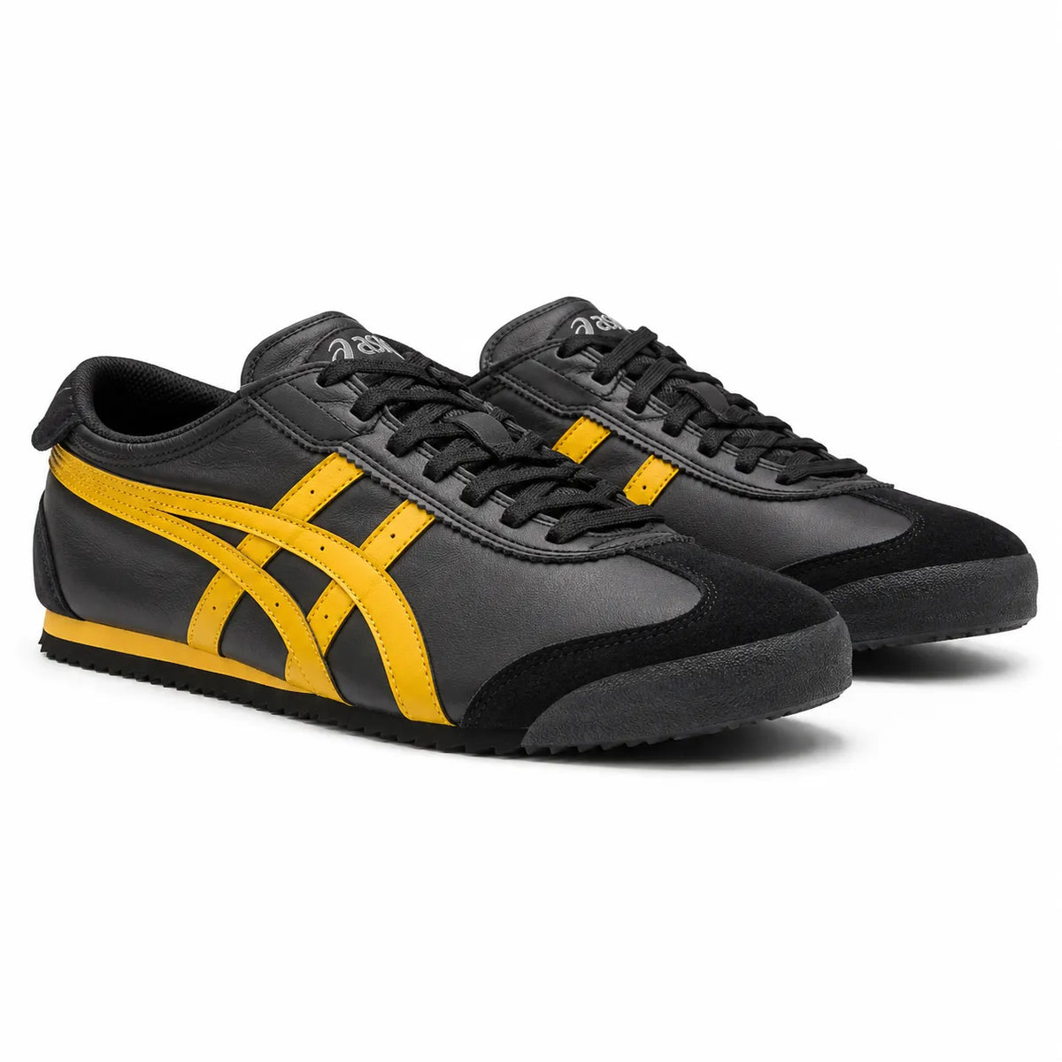 A pair of Onitsuka Tiger Mexico 66 sneakers in black leather and suede with bright yellow side stripes, shown on a clean white background.